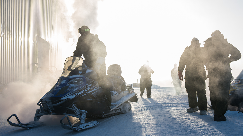 people with snowmobiles