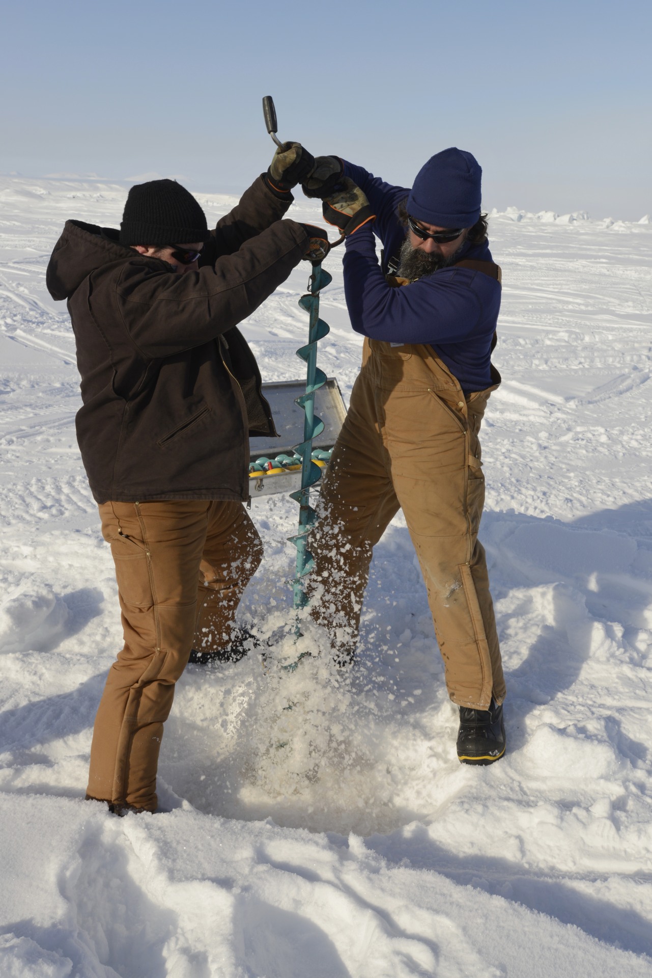 It takes a very long auger to drill through Arctic ice.
Photo by Janice Lang, DRDC