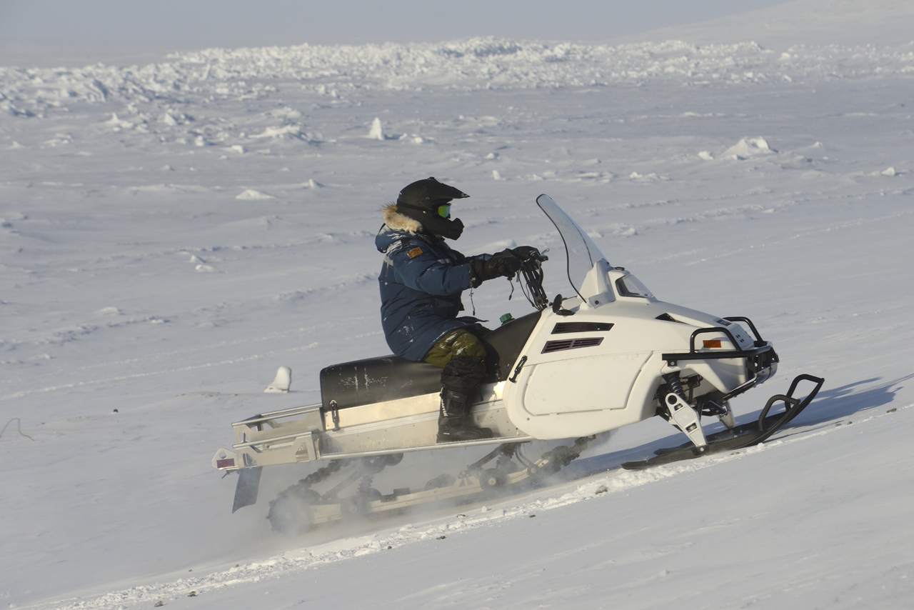 Defence Research and Development Canada and Canadian Armed Forces Joint Arctic Experiment (CAFJAE) 2016 team member Blaine Fairbrother test drives the DEW D900 snowmobile on Arctic terrain and ice during Operation NUNALIVUT at Resolute Bay, Nunavut, April 4, 2016. 
Janice Lang, DRDC