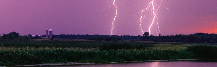 Lightning striking near farm land