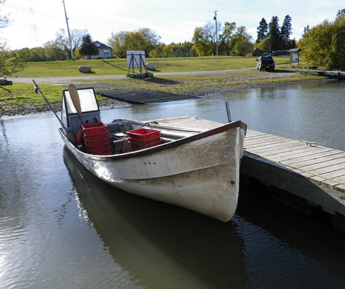 Image showing a boat docked at Hecla Village Harbour on Lake Winnipeg