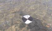 Secchi disk used to measure water clarity is highly visible. Source: Minnesota Pollution Control Agency