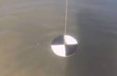 Secchi disk used to measure water clarity is slightly obscured. Source: Minnesota Pollution Control Agency