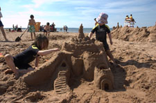 Kids building sand castles. 