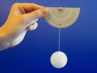 A protractor (held level) with a string hanging straight down that is attached to a ping pong ball