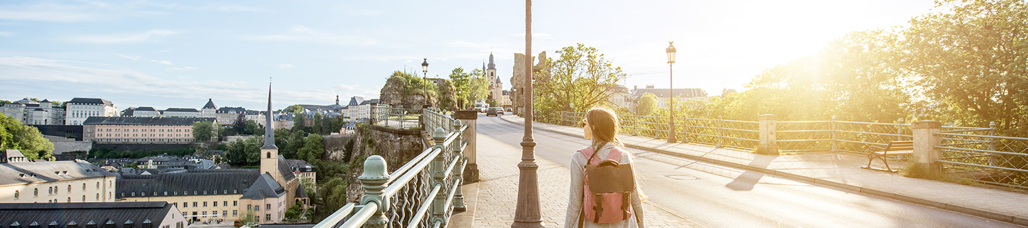 A young person walks over a bridge in Luxembourg