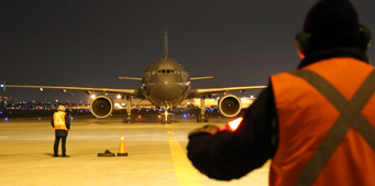 A Royal Canadian Air Force CC-150 Polaris aircraft with 163 Syrian refugees lands at Toronto Pearson International Airport.