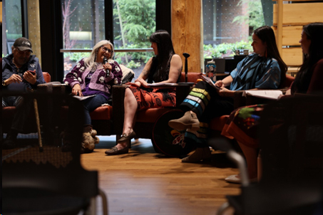 people sitting around a conference room table