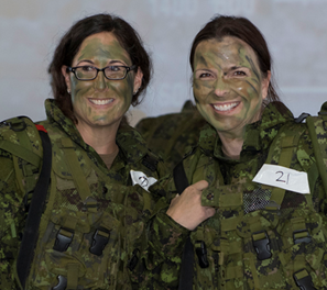 Two Canadian soldiers smiling