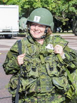 A Canadian soldier smiling