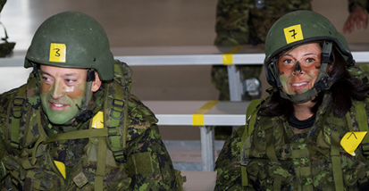 Two Canadian soldiers smiling