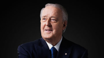 Profile of Brian Mulroney’s face against a dark background.
