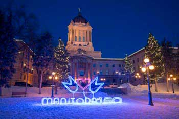 Christmas lights Winnipeg (Manitoba): Front of Legislative Assembly with neon Manitoba 150 sign