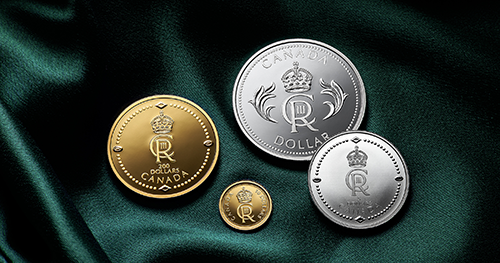 4 Canadian coins, 2 gold and 2 silver, depict King Charles III’s Royal Cypher. They are displayed on an emerald green fabric.