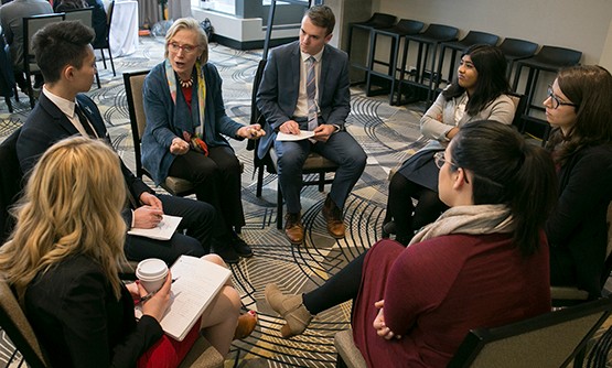 Minister Bennett discussing with PMYC members