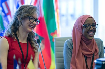 PMYC members sitting and smiling during the meeting