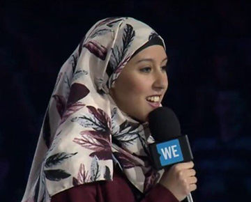 PMYC member speaking on stage at WE Day Atlantic