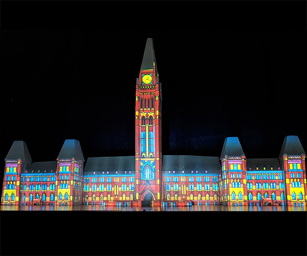 Coloured image of the Parliament of Canada on a black background