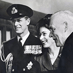 Black and white copy print of Princess Elizabeth, Prince Philip and Louis St. Laurent standing next to each other.
