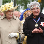 Queen Elizabeth II standing beside Sister Dorothy Moore, outside.