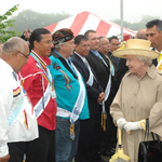 Queen Elizabeth II meets members of the Mi’kmaq community as she walks down a receiving line, outside.