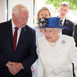 Queen Elizabeth II and Governor General David Johnston walking through the doorway of Canada House in London, England.