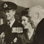 Black and white image of Princess Elizabeth, the Duke of Edinburgh and Prime Minister Louis St. Laurent standing next to each other.