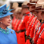 Close-up of Queen Elizabeth II looking at a RCMP guard of honour.