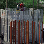 Overhead view of Memorial showing a ramp leading up to a viewing platform surrounded by slender bronze columns