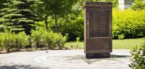 Photo of the stone memorial with the engraved names of 128 CANLOAN officers who died during the conflict.