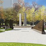 L’entrée du site commémoratif, avec vue en direction des piliers de granit qui se trouvent au centre