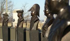 A row of five bronze busts at the Valiants Memorial