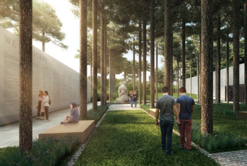A concrete wall and a bench. A grassed pathway with trees. People walking on the pathway looking at the wall. A sculpture embracing.