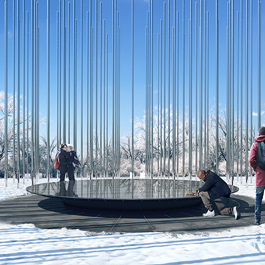 We see snow on the ground. People are gathered around a large reflective circle that is raised slightly from ground.  It is surrounded by many tall, slim stainless steel wands that look like flagpoles.