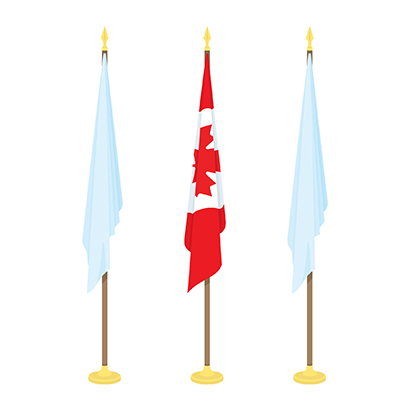 Three flags on stationary flagpoles with the National Flag of Canada in the center position.