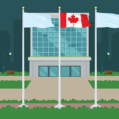 Three flags on tall stationary exterior flagpoles topped with sphere finials in front of a glass building with the National Flag of Canada in the center position.