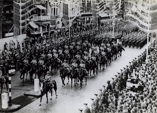 Royal Canadian Mounted Police on Parade on horseback in a London street