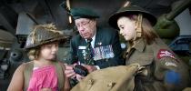 Veteran and two students at the Canadian War Museum