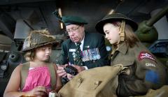 A veteran and two students at the Canadian War Museum