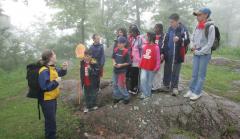 Photo of a group of students learning about nature with a guide at Gatineau Park