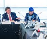 Dominic LeBlanc sitting at a table with a Métis Elder sitting to his right