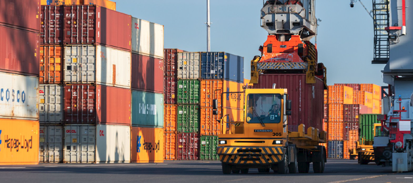 Cargo containers and a transportation truck carrying a cargo container