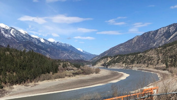 Banner image shows the landscape of two mountains in the village of Lytton, BC which was impacted by the wildfires.