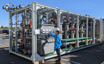 Image of a A Saltworks technician with an XtremeUF ultrafiltration system