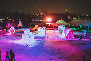 Snow sculptures with colourful lights displayed at night