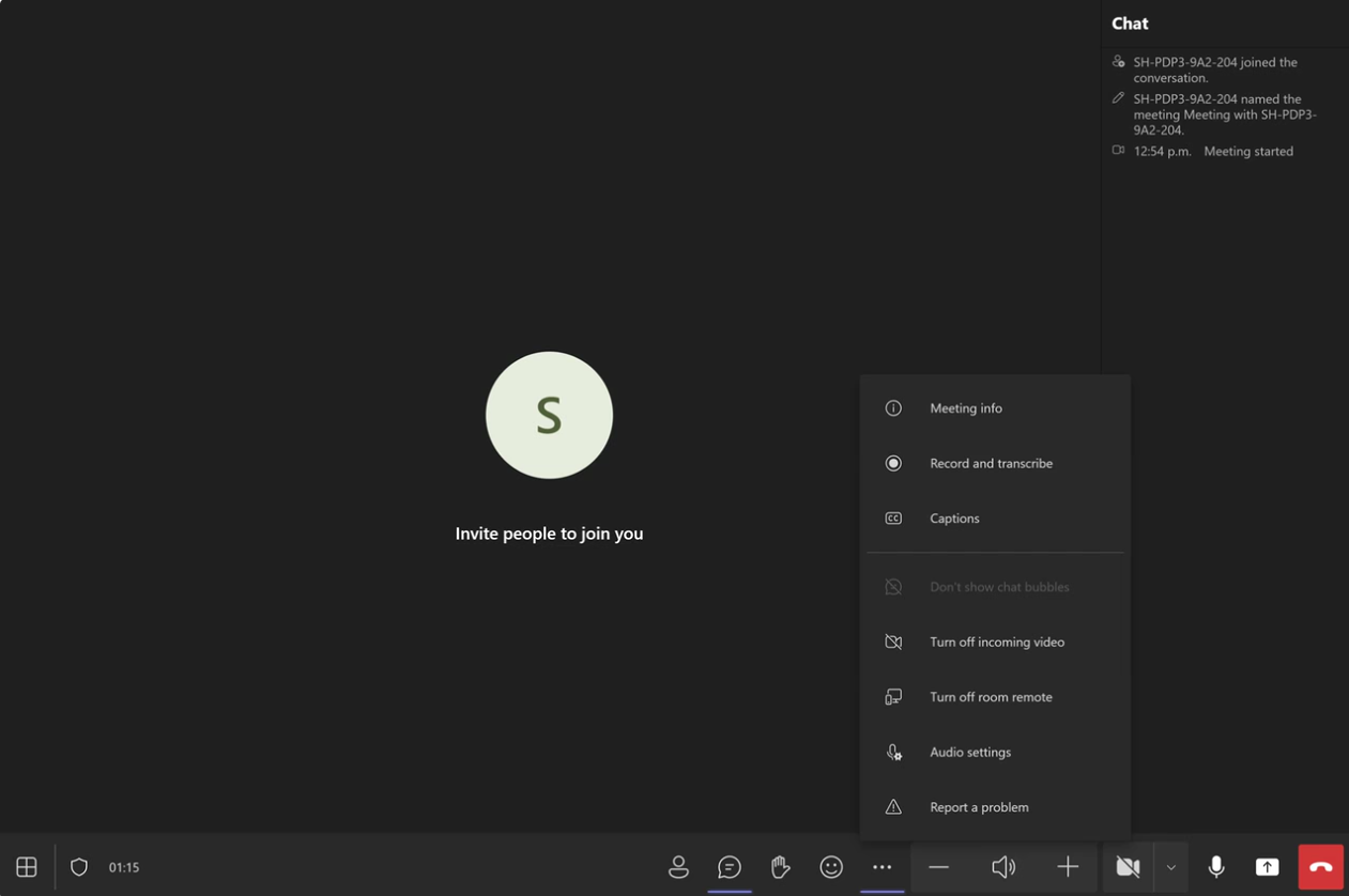 Teams meeting screen with chat, options menu, call controls like mute, share screen and end call.