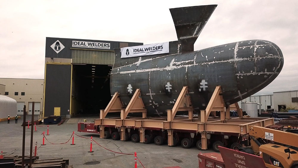 Bulbous bow piece of the first Joint Support Ship on supports in front of the Ideal Welders warehouse