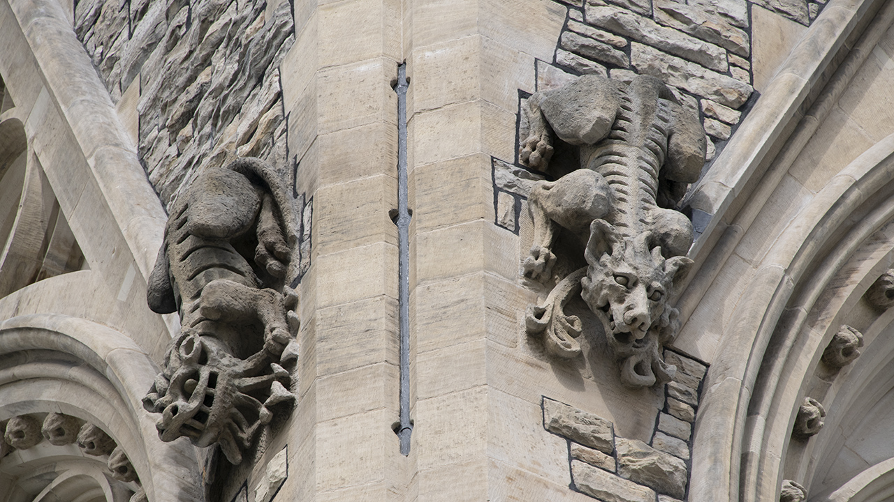 Grotesques and decorative elements around the perimeter of a tower