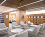 Enlarged image of the Entrance to the Supreme Court of Canada courtroom featuring bilingual signage, the Court’s official emblem, and a glass-railed walkway overlooking the atrium.