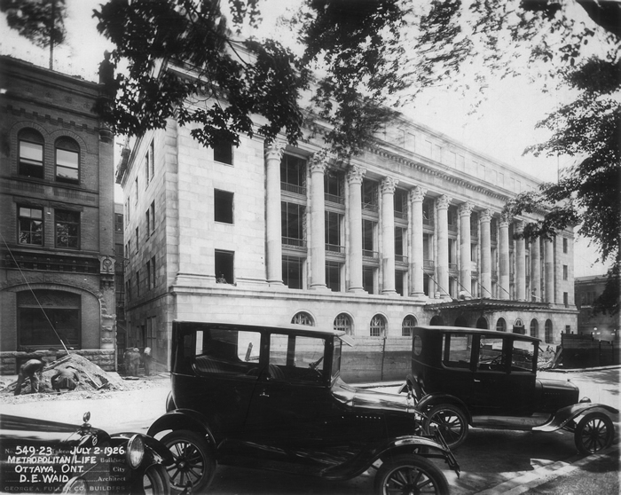 View enlarged image of the Wellington Building during its construction in July 1926.